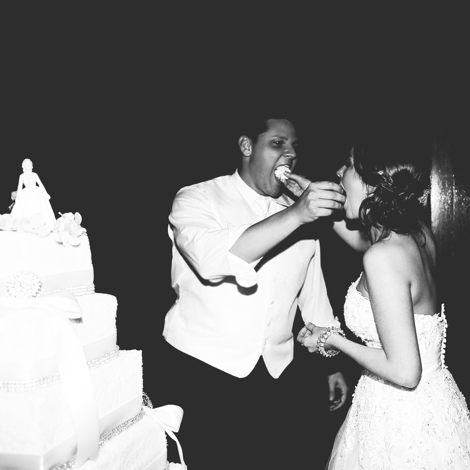 Newlywed Couple Eating a Wedding Cake